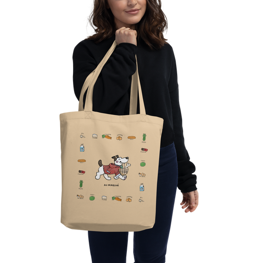 Au Marché - Eco ToteTake this cute pup with you on your way to the marché! This tote is 16″ × 14 ½″ × 5″ (40.6 cm × 35.6 cm × 12.7 cm) and made of organic cotton. On y va! 
cosmicindCosmic Industries