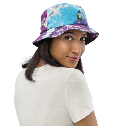 Cosmic ColorBlast - Bucket HatOur friend Bock, the chicken, has a new line of sports wear ready to blast you with color this season!! This bucket hat is tie dyed and embroidered with Bock and hiscosmicindCosmic Industries